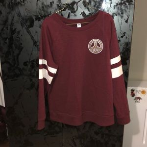 Maroon sweatshirt with peace sign